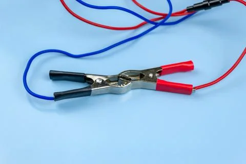 Jumper cable, on a blue background Stock Photos
