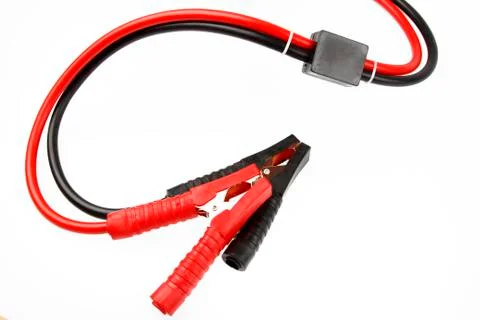 Jumper cables on plain background Foto stock