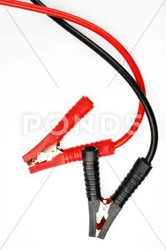 Jumper cables on plain background Stock Photos