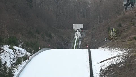 Jumper flying over ski jump ramp Stock Footage 151208952