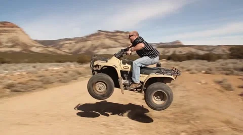 Jumping 4 Wheeler ATV Stock Footage 47035692