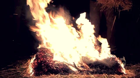 Jumping above burning hay   Stock-Footage 86278318