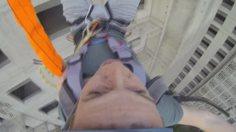 Jumping back face from 16 floor slow-motion 60 fps Stock Footage 25770029