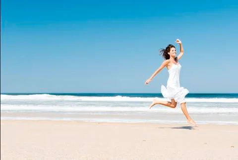 Jumping in the beach Stock Photos