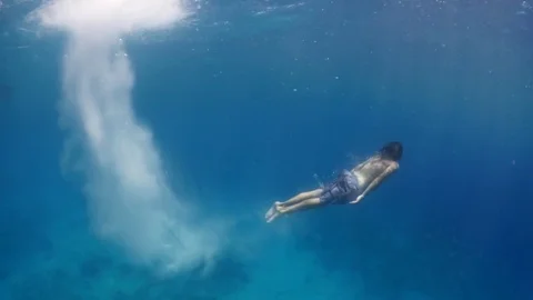 Jumping in to the blue Video stock 72290063