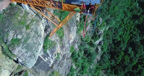 Jumping off a Cliff. Aerial Bungee Jumping Vídeo Stock 88456071