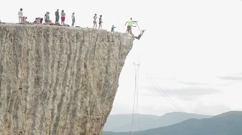 Jumping off a cliff, rope jumping 스톡 동영상 53779885