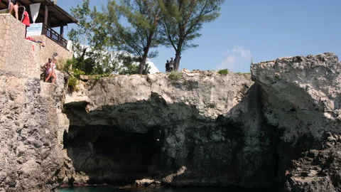 Jumping from Cliffs Ricks Cafe Jamaica Stock Footage 135135425