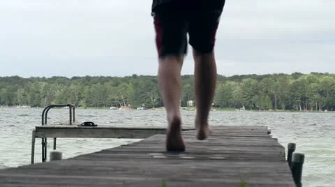 Jumping Off Dock Stock Footage 22782148