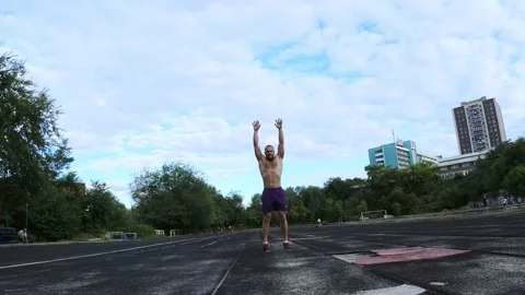 Jumping exercise in a sand pit of an ath... | Stock Video | Pond5