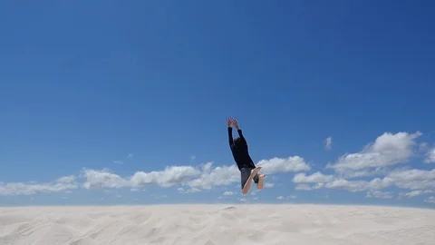 Jumping off face of the earth, courageous leap into the unknown Video stock 106938365