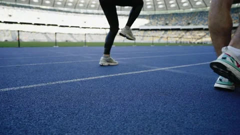 Jumping foot on the stadium, close-up Stock Footage 171566320