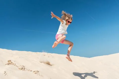 Jumping girl Stock Photos