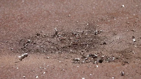 Jumping grains of rust and spiral borings on shaking old brown iron surface. Stock Footage 96883952