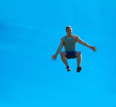 Jumping up guy. Background blue sky. Stock Photos