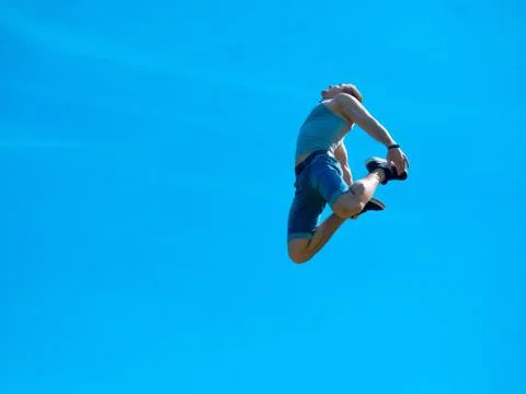 Jumping up guy. Background blue sky. Stock Photos