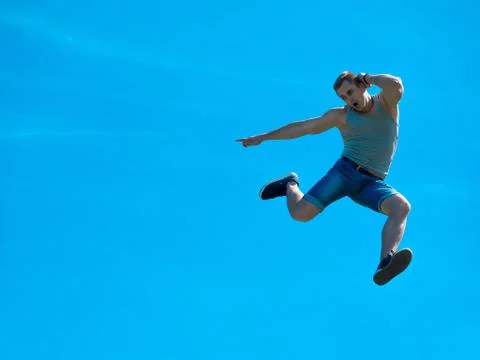 Jumping up guy. Background blue sky. Foto stock