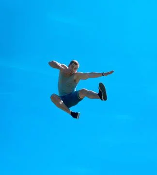 Jumping up guy. Background blue sky. Foto stock