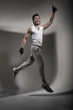Jumping handsome man during training Stock Photos