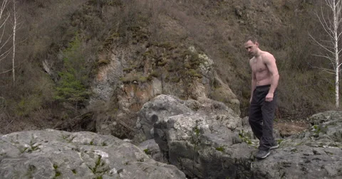 Jumping karate in slow motion in the mountains Stock Footage 63033784