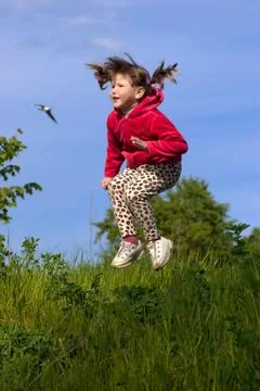 Jumping kid Stock Photos