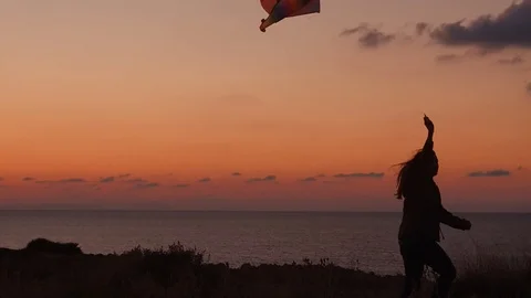 Jumping with kite 2 Stockbeeldmateriaal 97837870