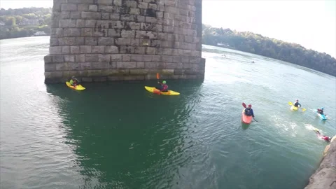 Jumping from a ledge into the Menai Stock Footage 160269134
