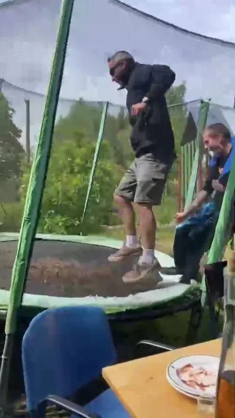 Jumping Men Tip Over Trampoline - 25 May 2025 Stock Footage 312825808