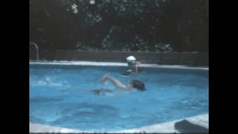 Jumping Into the Pool 1969 Stock Footage 211900230