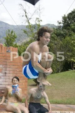 Jumping into Pool Stock Photos