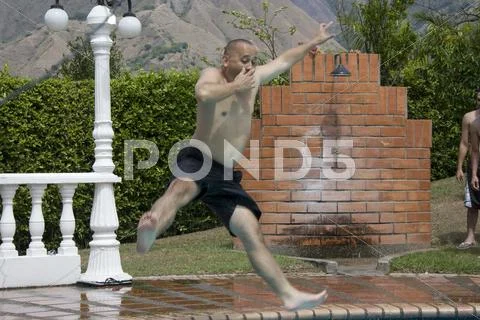 Jumping into Pool Stock Photos