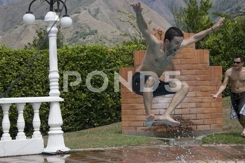 Jumping into Pool Stock Photos