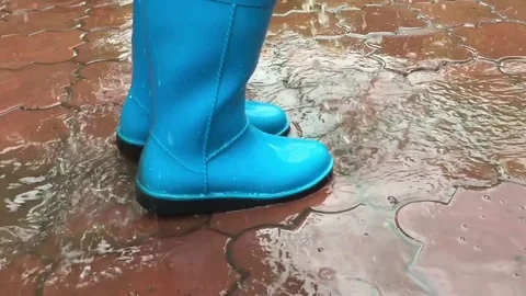 Jumping in a puddle Stock Footage 78783381