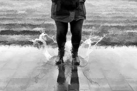 Jumping in a puddle of water Stock Photos