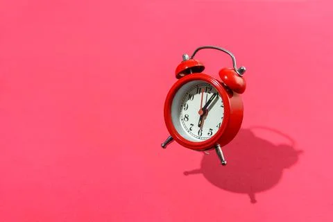 Jumping red alarm clock Stock Photos