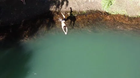 Jumping to the river, blue river, turquoise river, stream river, argentina, Stock Footage 147974003