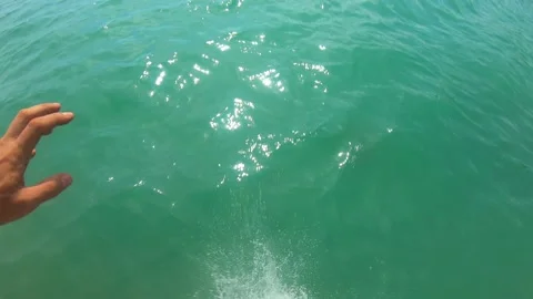 Jumping from rock into the sea Stock Footage 132818057