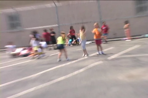 JUMPING ROPE IN SCHOOL YARD Video stock 156878