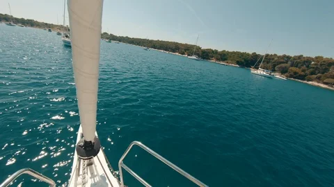 Jumping from a Sailboat Bow and Diving in the Blue Water of Mediterranean Sea Stock Footage 111910344