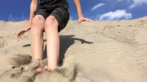 Jumping Off a Sand Dune Stock Footage 130296126