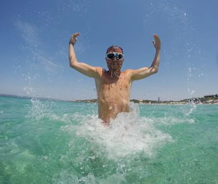 Jumping in the sea Stock Photos