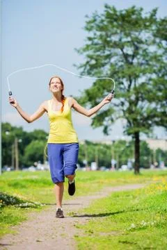 Jumping with skipping rope Stock Photos