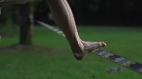 Jumping on a slack line Stock Footage 41813854