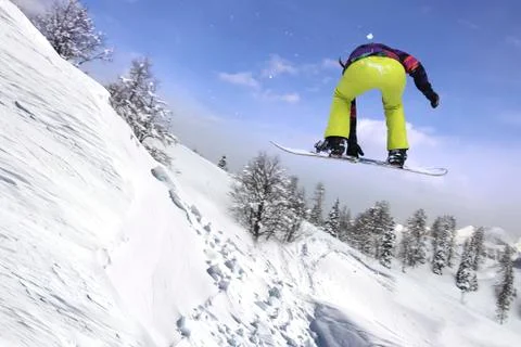 Jumping snowboarder Stock Photos