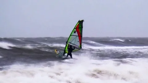 Jumping surfer in high waves Video stock 84327496