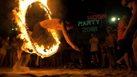 Jumping Through Fire Hoop At Full Moon Party Video stock 120546051