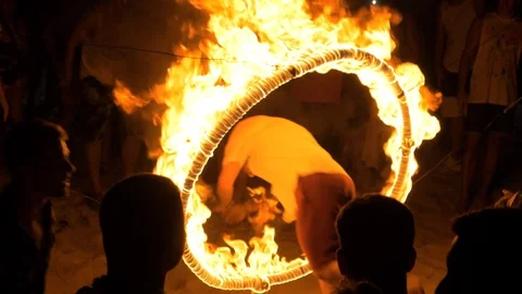 Jumping Through Fire Hoop Full Moon Party Video stock 120546053