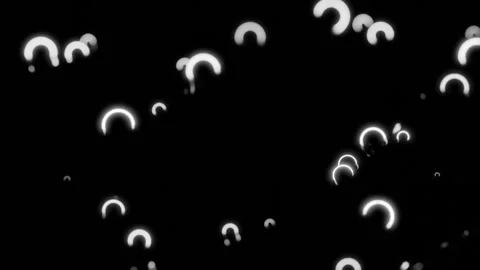 Jumping tiny arcuate neon shapes on a black background. Design. Small particles 스톡 동영상 259122760