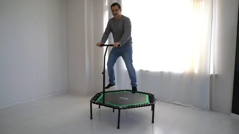 Jumping on a trampoline 库存影片 117679033