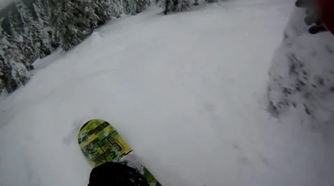 Jumping in trees on snowboard Stock Footage 22475902